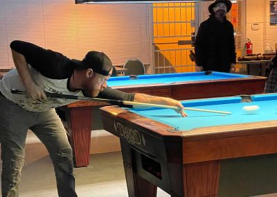 District-Billiards-man-at-end-of-table